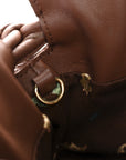 X SUNA FUJITA Nappa Flamenco Knot Clutch Havana
